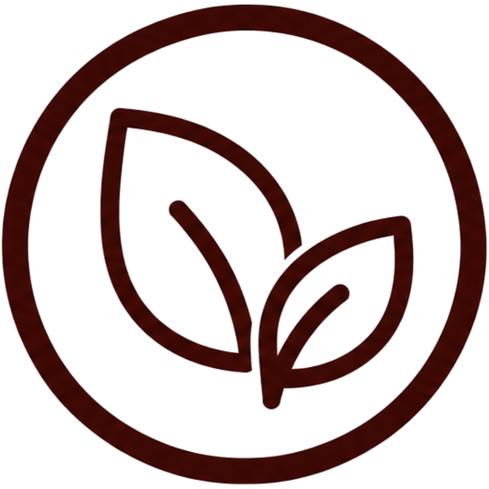 A dark brown circular icon featuring two stylized leaves, commonly used as a 'natural' or 'eco-friendly' certification symbol.
