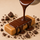 Handcrafted dark chocolate being poured over a ntty peanut butter protein bar.