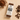ntty brownie protein bar surrounded by a bowl of cocoa powder, chocolate and coffee beans