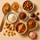 Real food ingredients used to make ntty refrigerated peanut butter protein bars, including peanut butter, honey, almond flour, cocoa, dates, and sea salt.