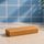 ntty refrigerated peanut butter bar on counter with blue backdrop.