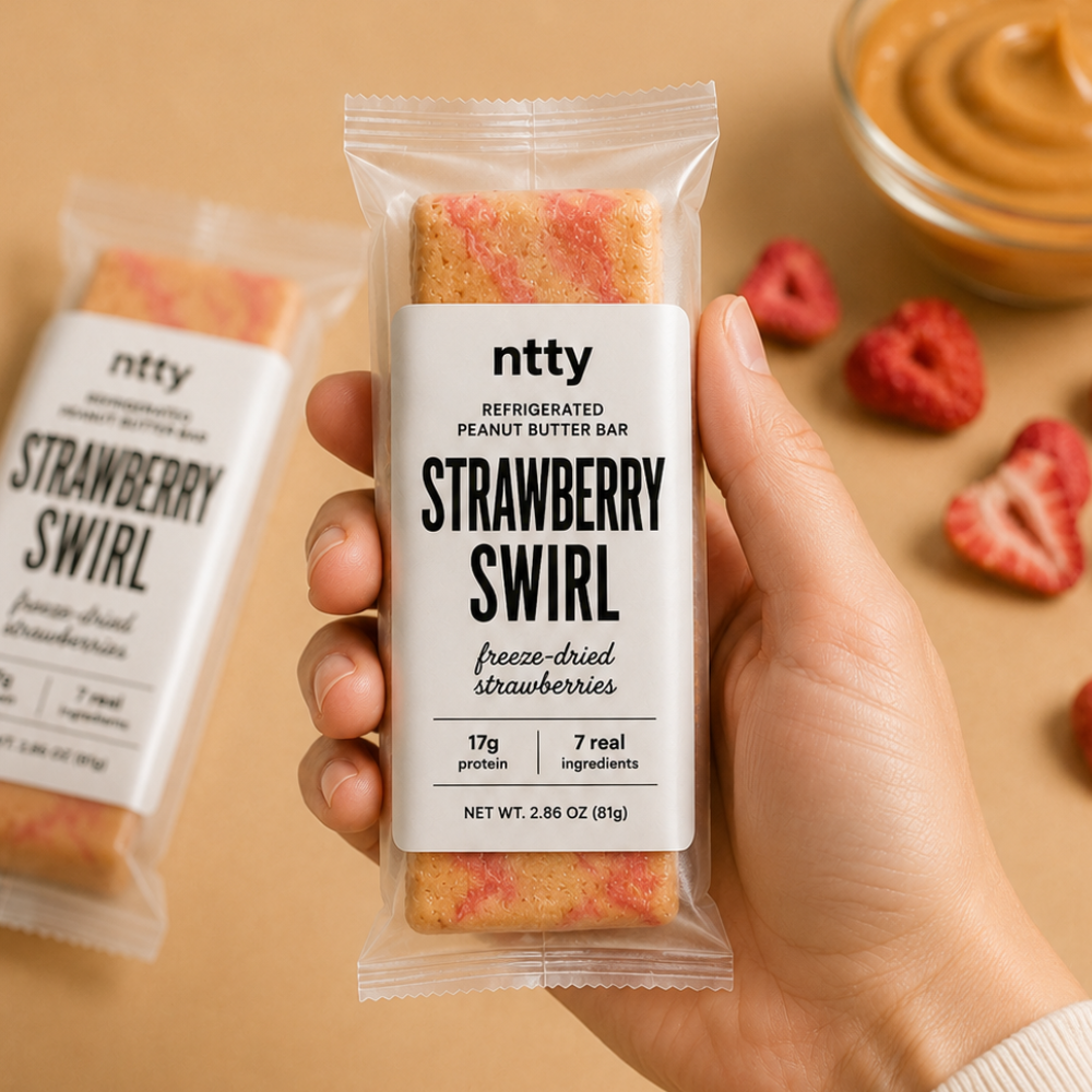 A packaged ntty refrigerated strawberry swirl bar.
